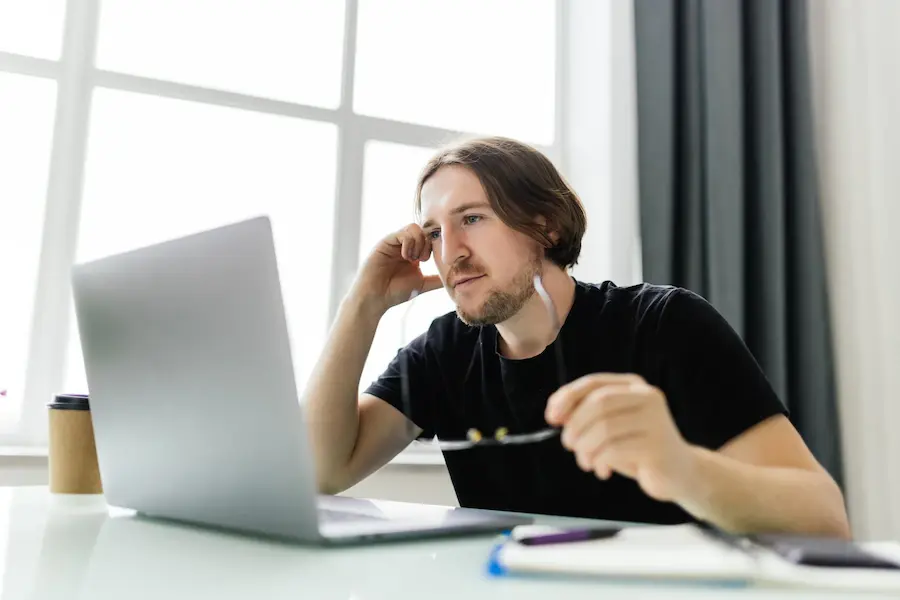 man looking at his down wordpress website